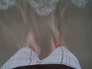 Surf beneath Adam's feet